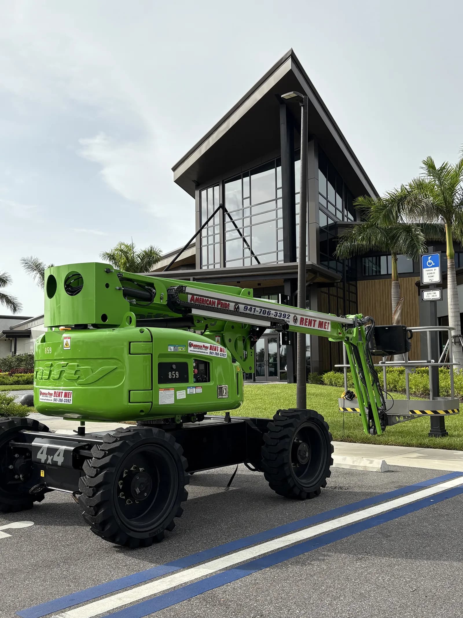 Commercial building window film installation using boom lift