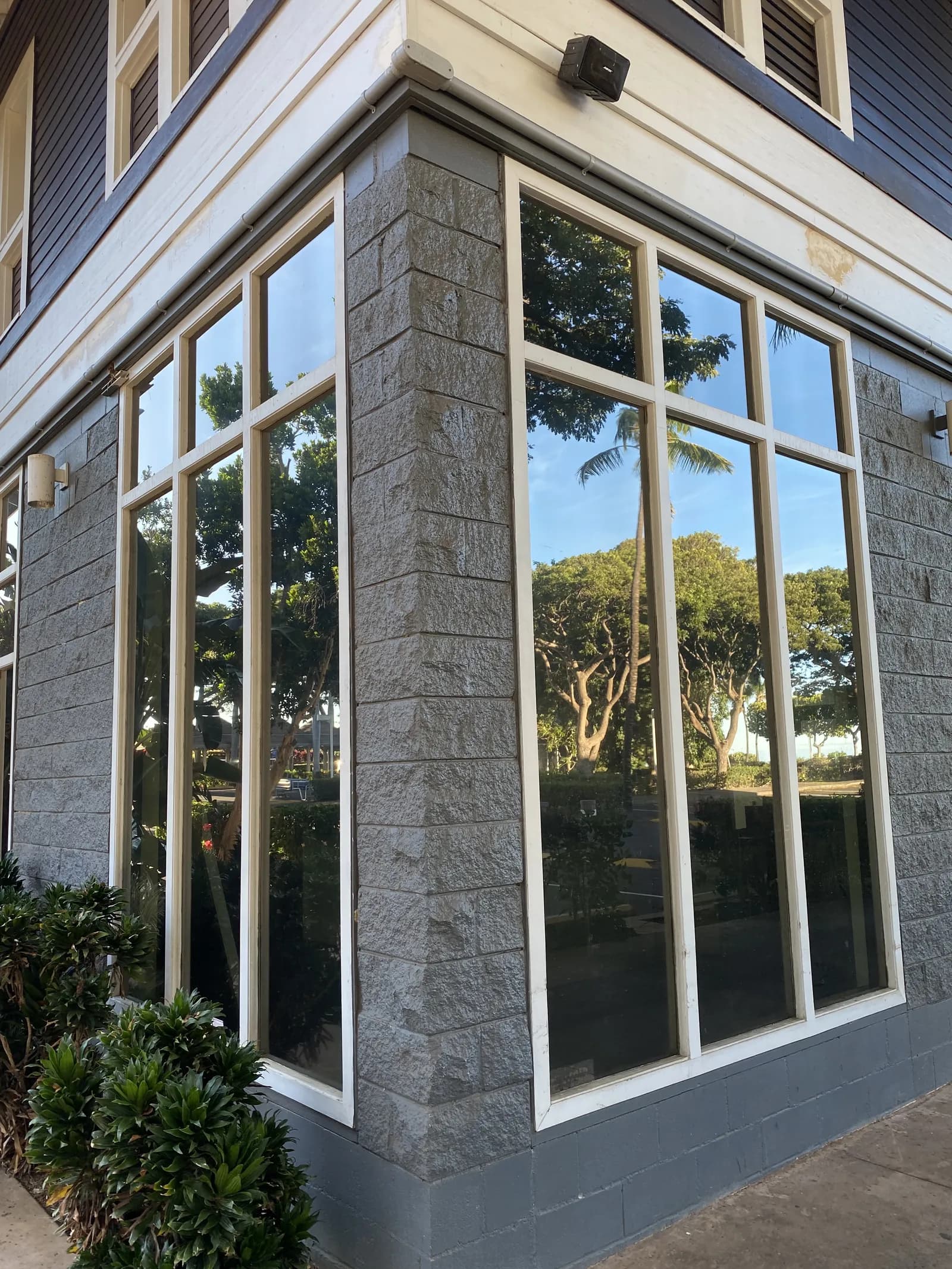 Corner storefront glass with security film installed