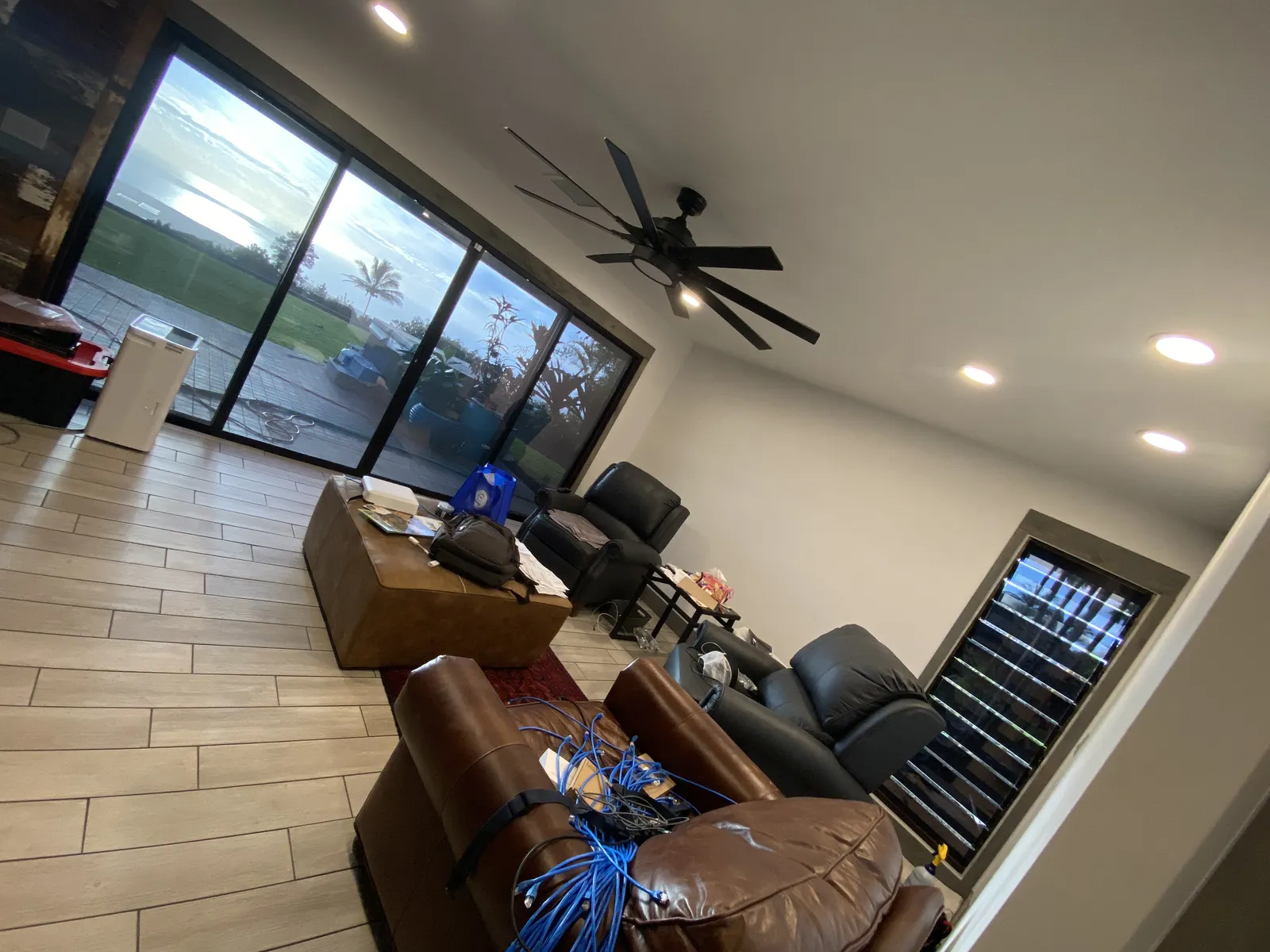 Living room with tinted sliding glass doors ocean view